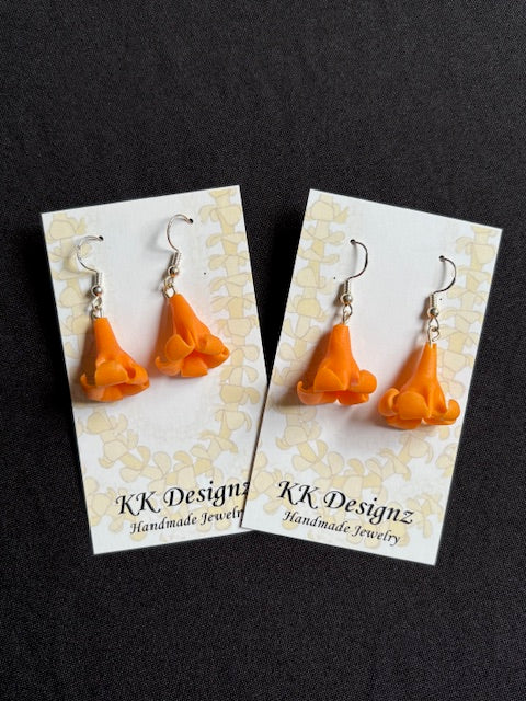 Single Orange Puakenikeni Flower on Silver